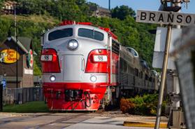Vintage passenger train pulling into the Branson station, showcasing Branson kid friendly activities