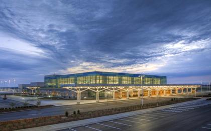 Exterior view of the modern terminal at Springfield�Branson National Airport at dusk, highlighting convenient shuttle from Springfield Airport to Branson for travelers and groups.