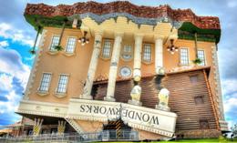 Upside-down WonderWorks building in Branson, Missouri, with its inverted roof and fa�ade against a blue sky�an eye-catching, hands-on attraction popular with Branson Group Tours seeking interactive fun.